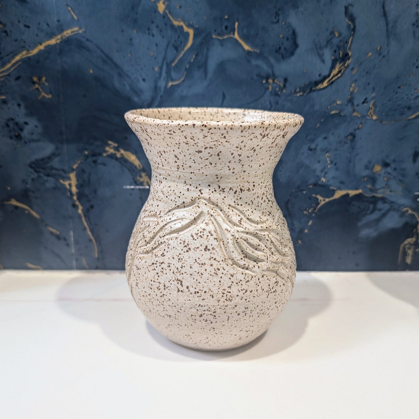 Small speckle bouquet vase with carvings