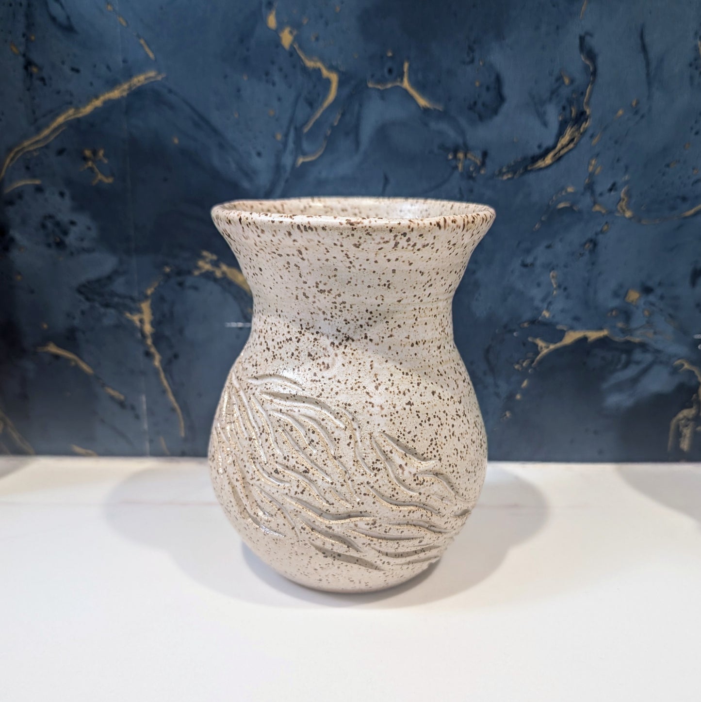 Small speckle bouquet vase with carvings